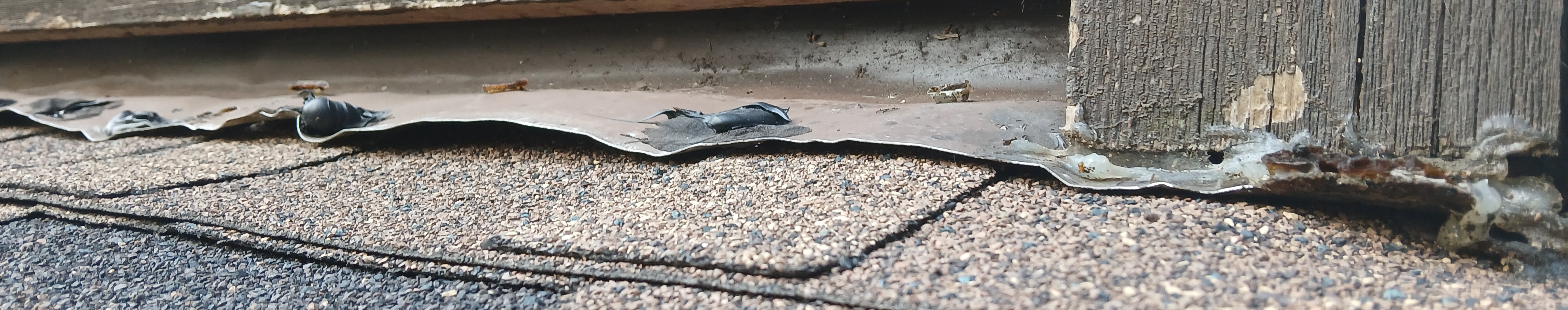 Failed roof repair by Summit Roofing with exposed defects